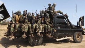 Members of al Shabaab ride in a pick-up truck outside Somalia's capital Mogadishu